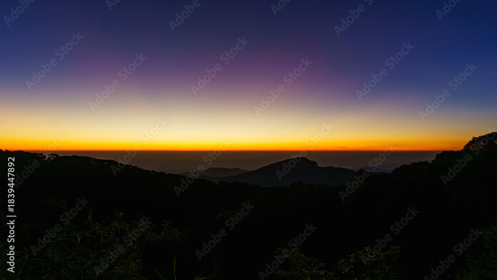 Fototapeta premium Beautiful green mountain landscape of colorful sunrise shining over Doi Inthanon at Mae Jam, Chiang Mai, Thailand.