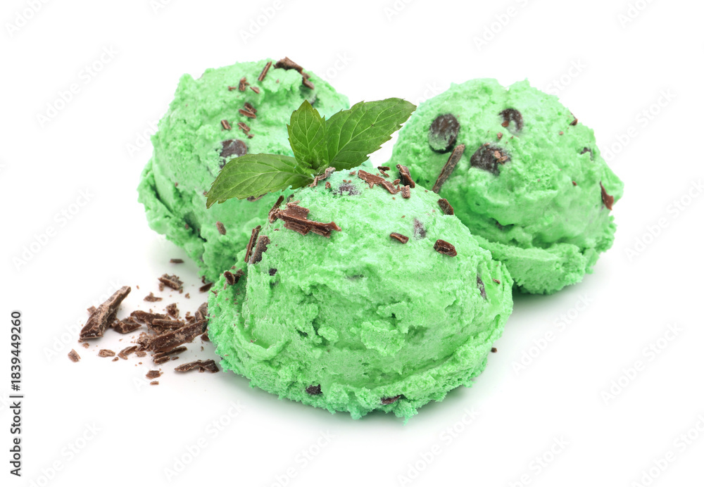 Obraz premium Balls of mint chocolate chip ice cream with leaves isolated on white