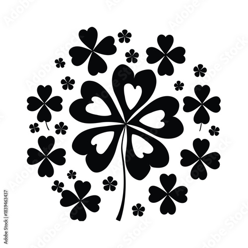 Black Four Leaf Clover Surrounded by Smaller Clovers lucky luck