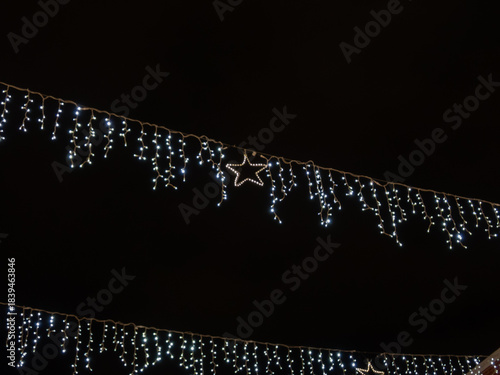 Christmas lights against the dark sky