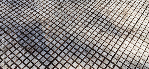 a type of flooring with geometric shapes made of small squares