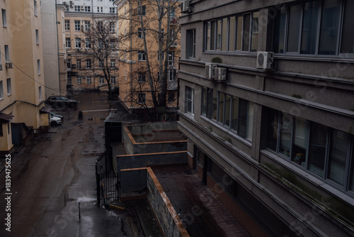 A city street on a cold cloudy rainy day