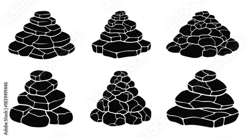 A collection of stacked stone cairns in varying shapes and sizes