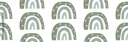 Cute seamless pattern with pastel boho rainbows. Modern decorative design for nursery or kids room. Vector illustration on an isolated background.