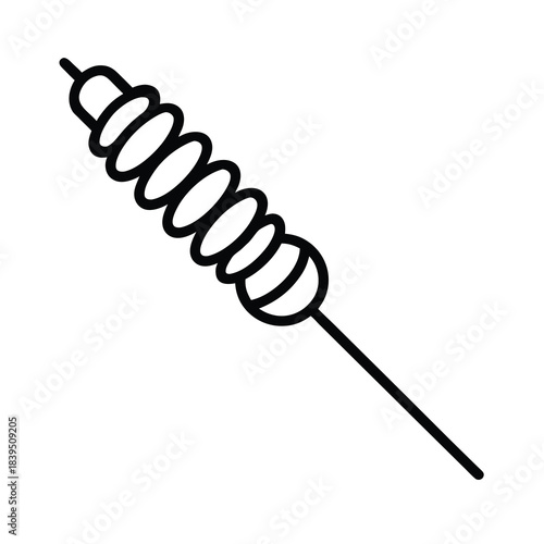 Closeup of a metal wire whisk and sharp golden needle with a black electric cable as isolated work equipment