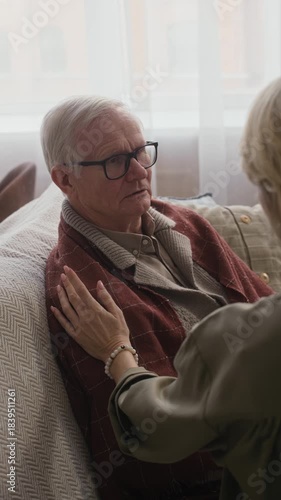 Wallpaper Mural Vertical shot of woman touching forehead of sick senior father while checking his fever during home visit Torontodigital.ca