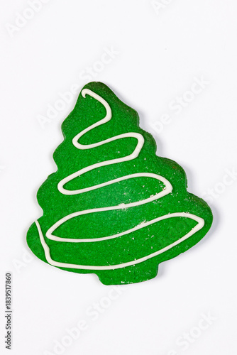Festive isolated decorated green Christmas tree cookie