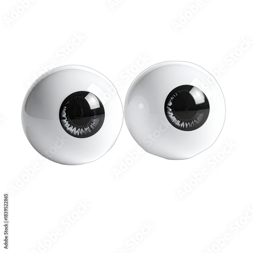 Two glossy white prosthetic eyeballs with dark irises set against a black background.