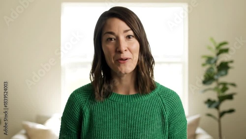 Confident Woman in Green: A portrait of a woman exudes confidence and approachability, dressed in a vibrant green top. The scene is illuminated by natural light.
