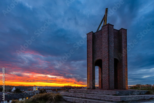 Kap (the cape), a landmark for shipping and symbol of the East Frisian island of Norderney, Germany at sunset