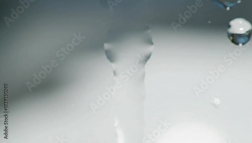 Refreshing Cascade: Capturing the elegance of a clear, flowing water stream, each droplet and ripple creating a serene atmosphere.