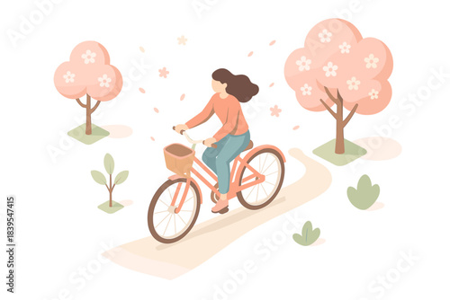 Woman cycling in blossom park on a spring day