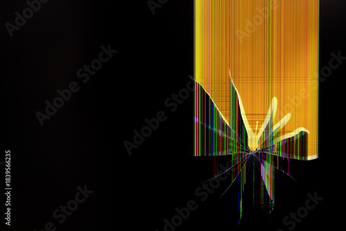 Cracked electronic screen displaying vibrant distorted pixel lines and abstract yellow light, symbolizing serious technological malfunction, data corruption, or system failure