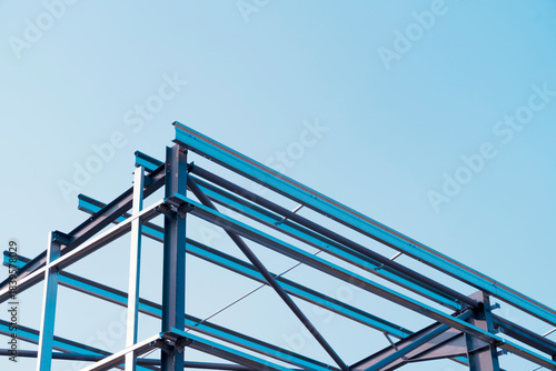 Obraz na płótnie Framework of modern steel frame structure against clear sky