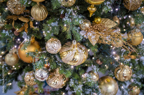 Gold and Silver Ornaments on a Christmas Tree.