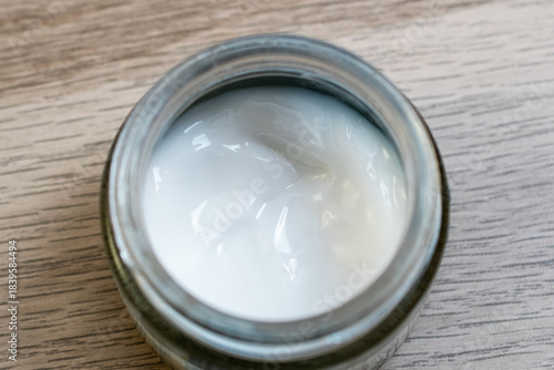 Skincare Cream Jar on Wooden Table