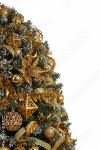 Christmas tree decorated with gold ornaments and ribbons during holiday season