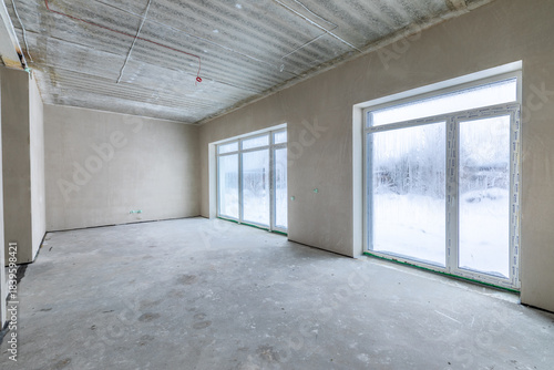 Wallpaper Mural The room is under construction with a rough finish, plastered walls, concrete floor. Living Room Bedroom Area Torontodigital.ca