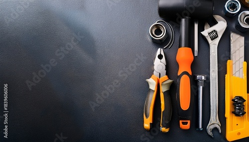 tools arranged on a dark surface