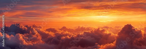 Vibrant Sunset Horizon: Dreamy Cloudscape with Rich Red, Orange, and Yellow Hues in the Sky
