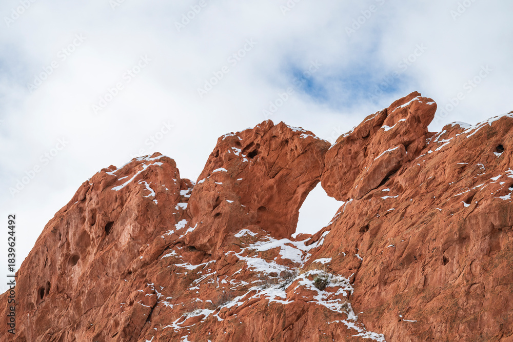 Fototapeta premium Kissing Camels red rock formation dusted with snow at Garden of the Gods Park in Colorado Springs, CO.