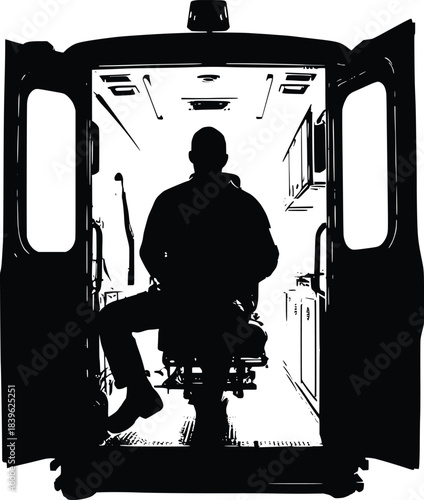 Silhouette of man sitting inside open back ambulance
