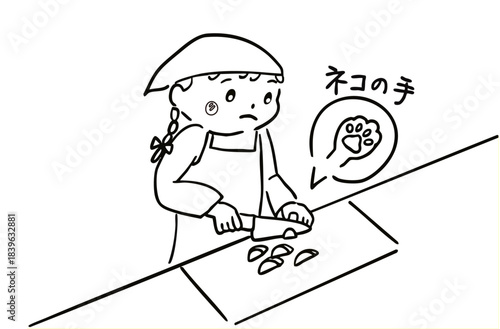 料理で包丁を使う女の子／モノクロ
