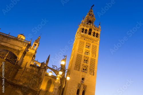 La Giralda, The Belltower Of The Cathedral Of Seville At Dusk