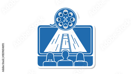 Audience watches a film reel projected onto a large screen in a dark cinema hall with spotlights illuminating the scene