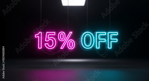 Neon sign with 15 percent off glowing in pink and blue light on dark