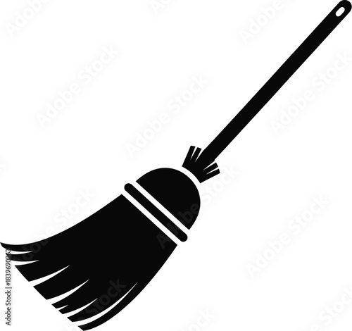 A simple black and white illustration of a traditional straw broom