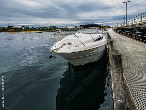  Deep Hulled Cruiser Moored Beside Pier