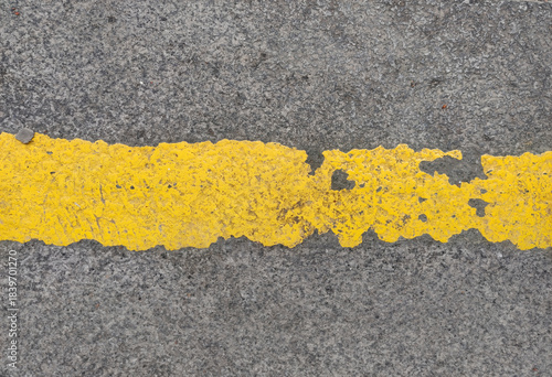 Wallpaper Mural Extreme texture detail of gray asphalt pavement crossed by a vibrant yellow road line exhibiting heavy peeling and traffic wear. Excellent textured design element. Torontodigital.ca
