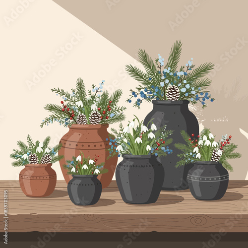 Decorative Christmas flower arrangements in terracotta and ceramic pots on a wooden table with a