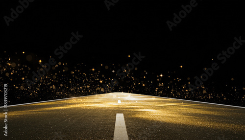 Golden illuminated asphalt road stretching into a deep black void background.