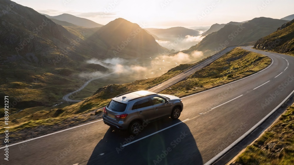 Fototapeta premium Compact SUV on Elevated Ridge Road During Sunrise