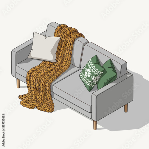 Cozy living room setup with a plush gray sofa decorated with textured throws and pillows in a
