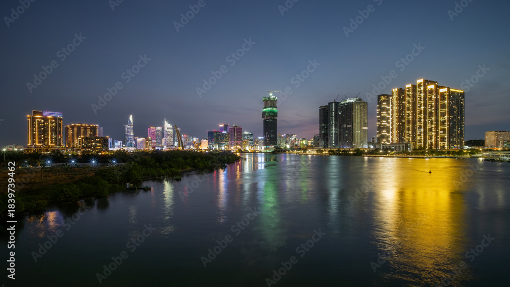 Naklejka premium August 12, 2024: sunset in District 1, Ho Chi Minh City, Vietnam