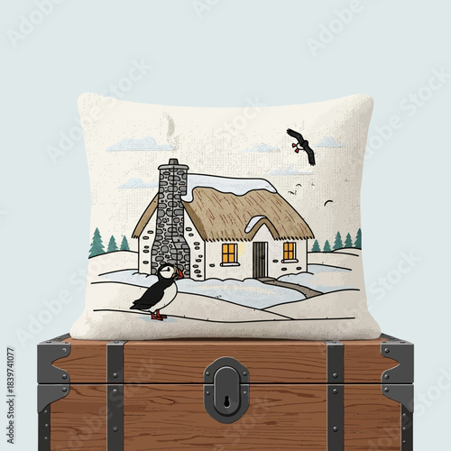 Cozy winter scene with a thatched-roof cottage surrounded by snow and birds on a decorative pillow