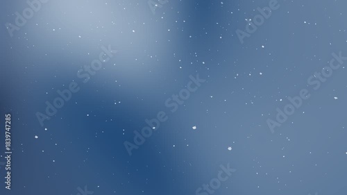 Cinematic abstract blue gradient background with falling white snow particles and soft bokeh effect suitable for winter holiday season video overlays and christmas motion graphics design
