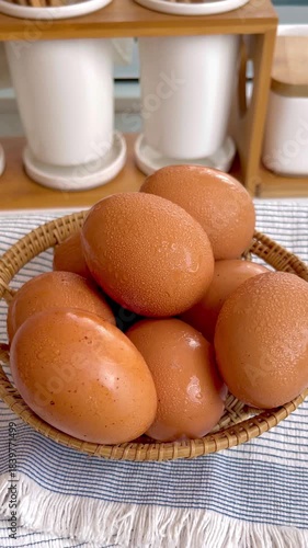 Fresh eggs arranged neatly in a woven basket, showcasing natural texture and warm lighting. Perfect for food, agriculture, farm lifestyle, and organic product concepts.