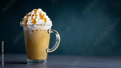 A tempting caramel latte topped with whipped cream, inviting indulgence on a chilly day, cozy vibes for a festive autumn treat