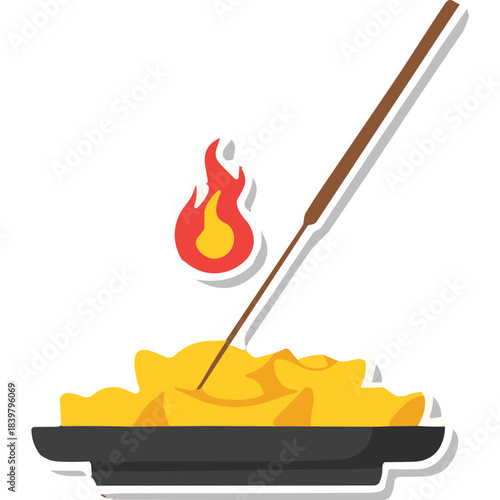 Incense stick burning in a dark bowl with yellow contents and a small red and yellow flame above a black background