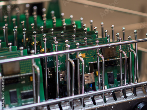  Advanced Technology: Close-Up of Green Circuit Boards in Cleaning Process