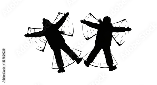 Silhouette of two people making snow angels in winter.