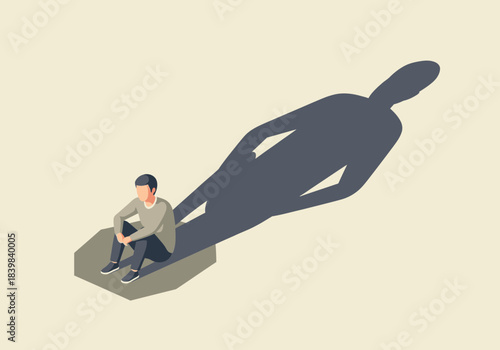 Man sitting with a large shadow of himself casting a long shape.