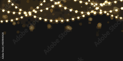 Warm glowing string lights illuminate a dark background creating a cozy atmosphere