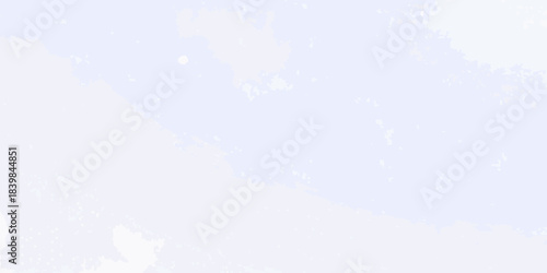 A pale blue sky with scattered fluffy white clouds floating peacefully