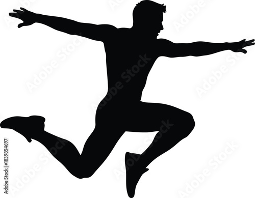 Silhouette of a man leaping dynamically with arms outstretched