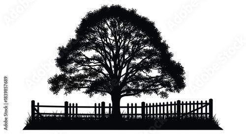 A striking black tree and picket fence against a bright white background silhouette